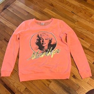 Large peach and gold Marilyn Monroe sweater with mesh back from rue 21